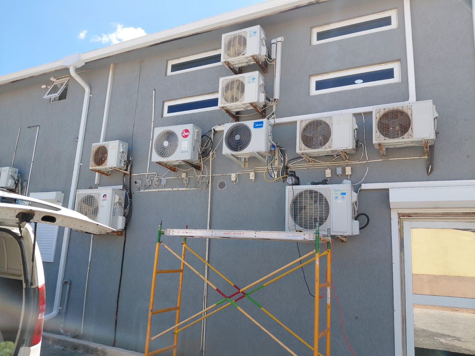 Multiple outdoor AC units installed on a commercial building exterior
